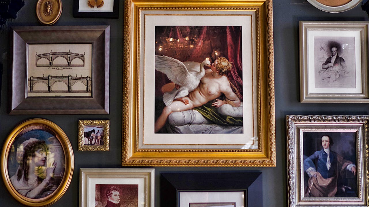 Art gallery with paintings displayed on white walls