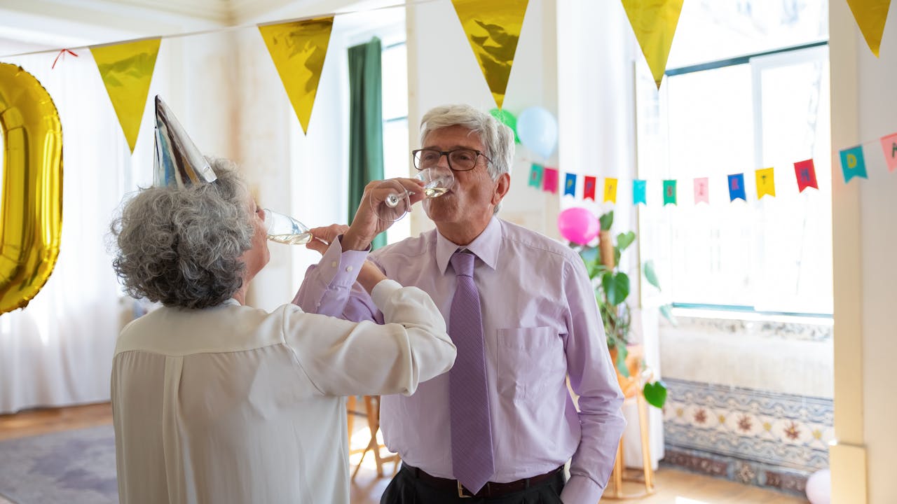 Elegant golden anniversary celebration with champagne and flowers