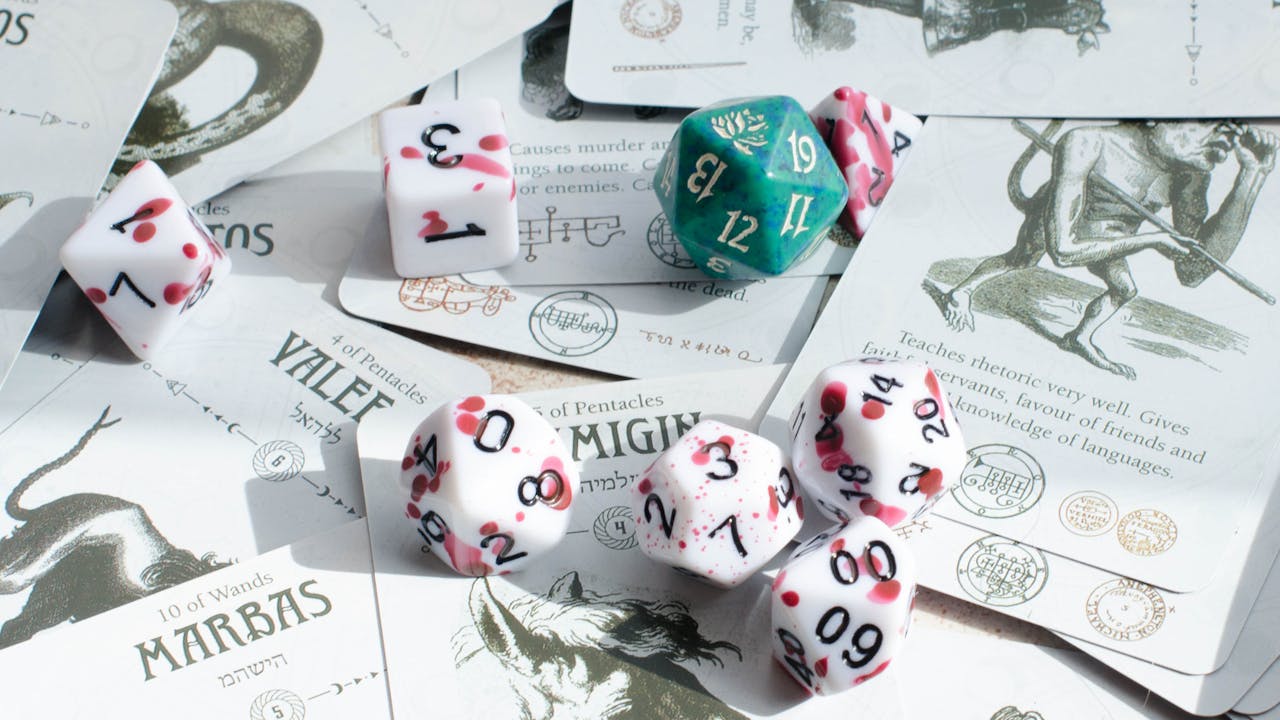 Tarot cards and polyhedral gaming dice creating an atmosphere of mystery and fantasy