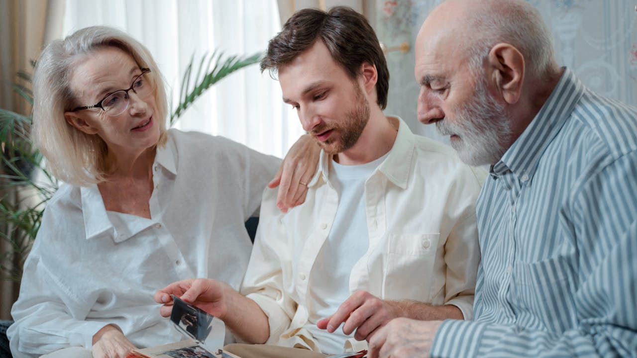 Family gathered around a beautifully framed portrait on the wall