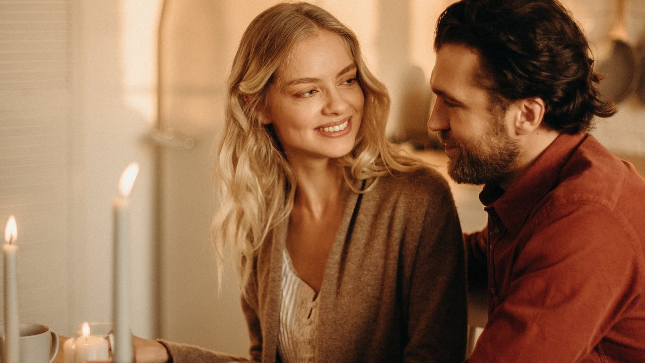 Couple enjoying a romantic dinner with wine