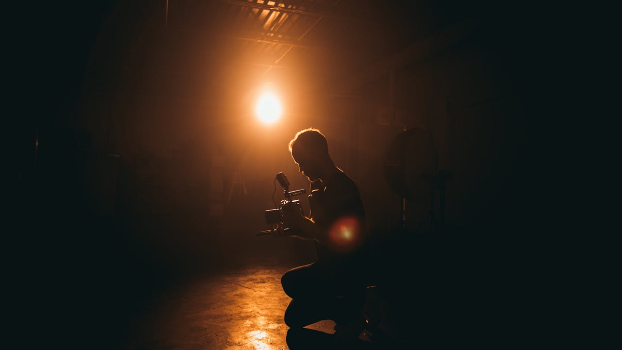 Photographer at work during a portrait session with professional lighting setup