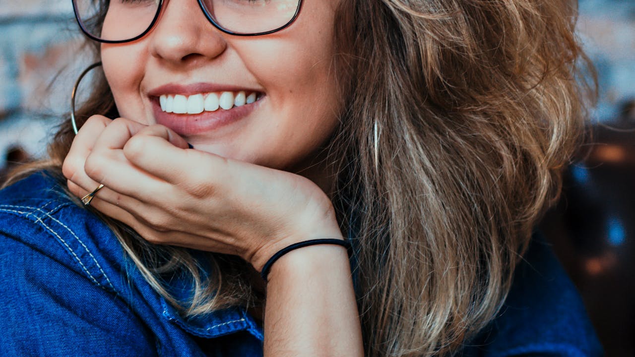 Candid laughing portrait of a high school senior during outdoor photo session