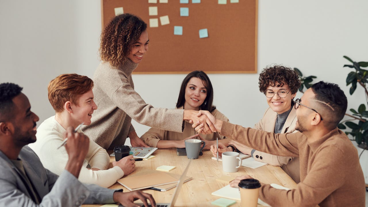 Employee recognition gift presentation in office setting