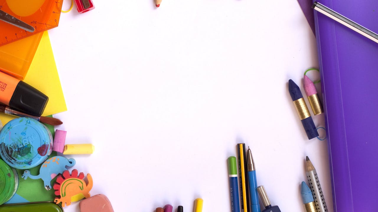 Professional art supplies arranged on a wooden desk