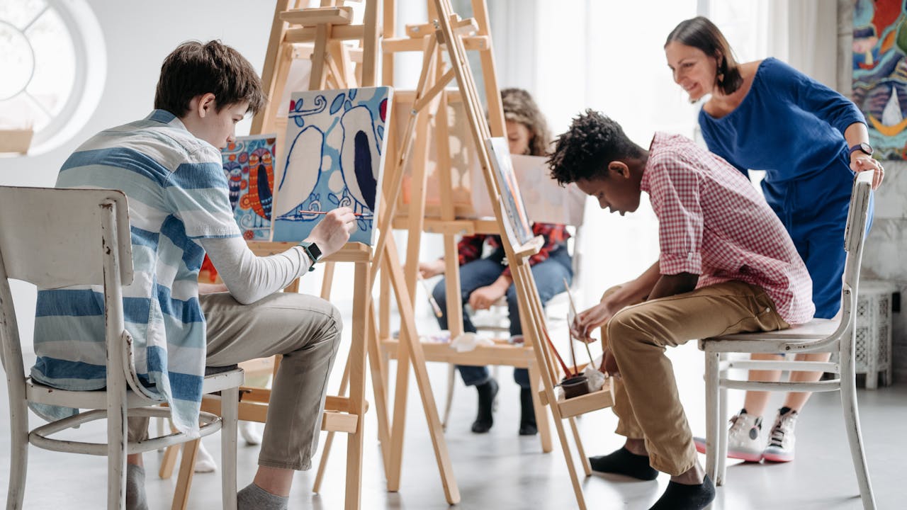 Art teacher in a colorful creative classroom