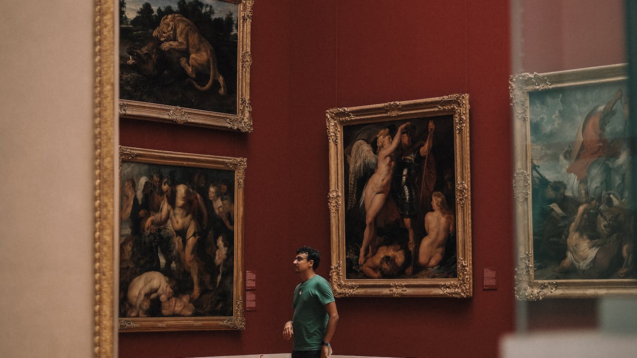 Person enjoying art in a museum gallery