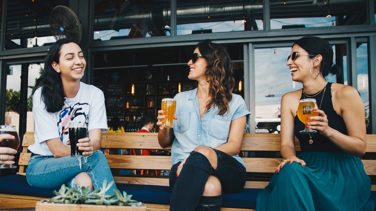 Group of friends celebrating with personalized gifts at a bachelor party
