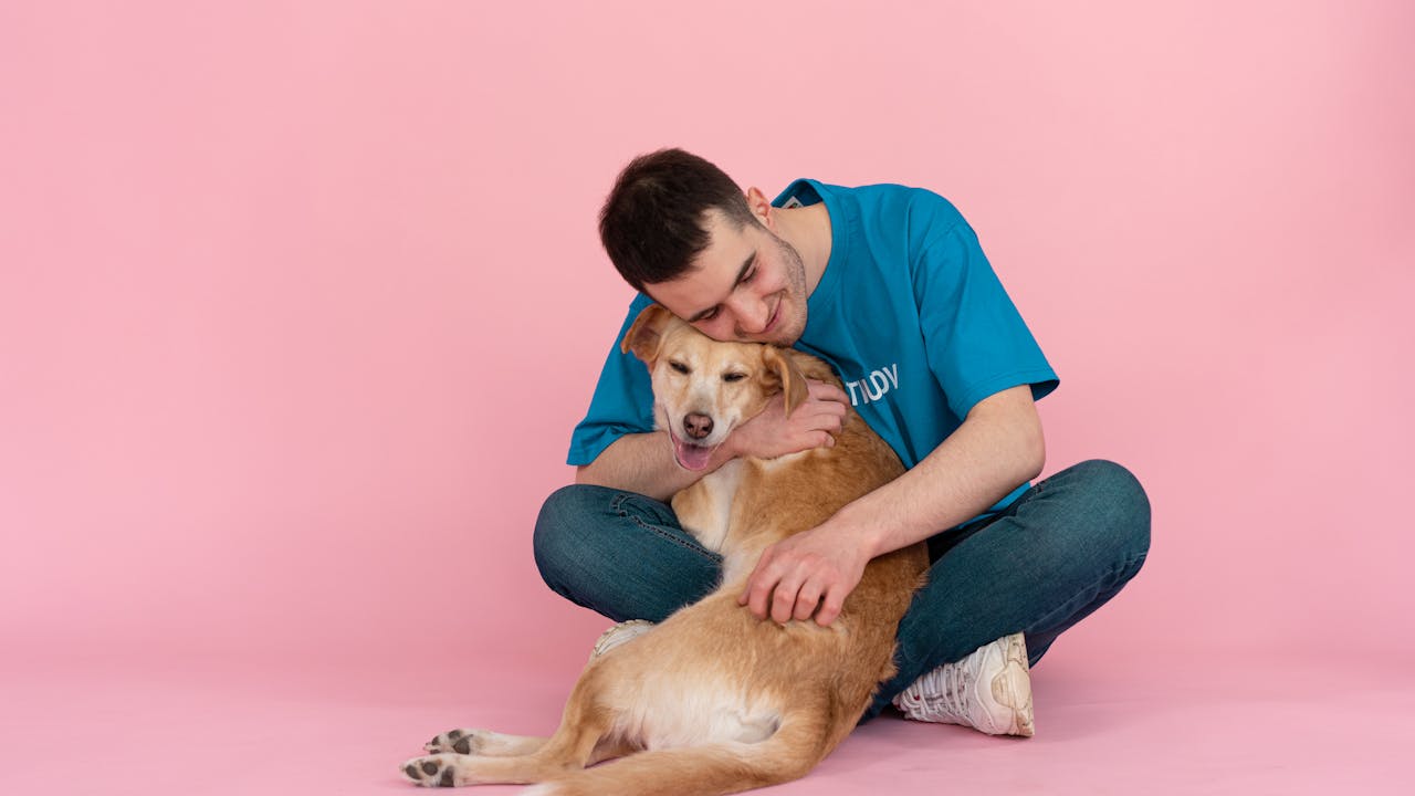 Dog owner sharing an affectionate moment with their pet, the bond that inspires custom portraits