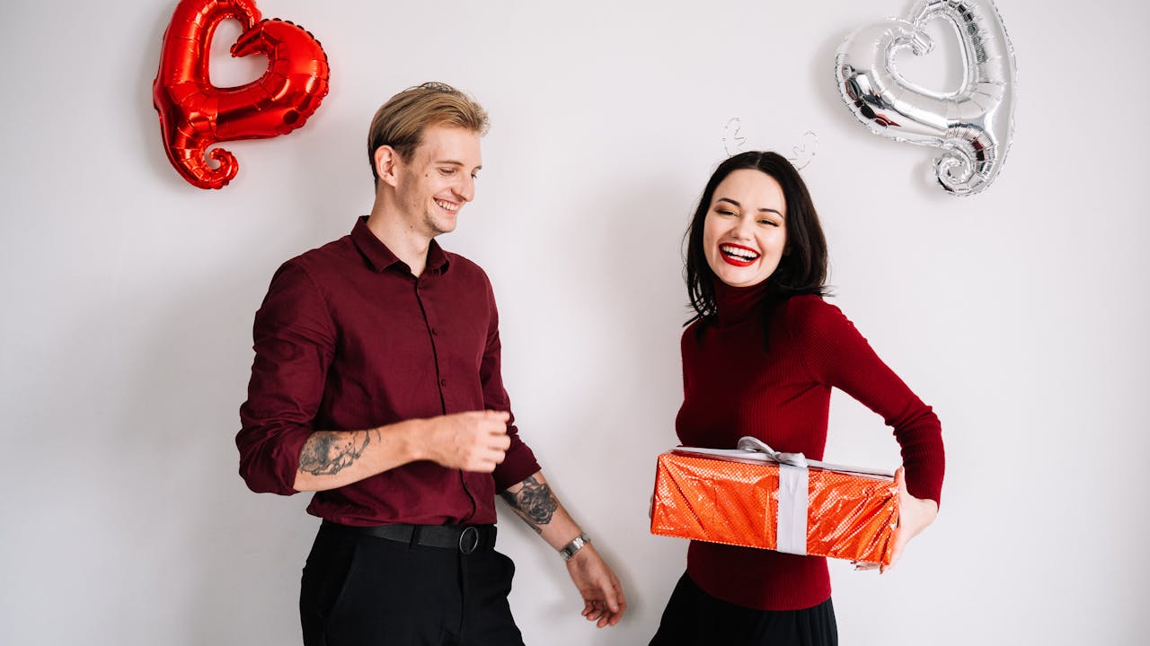 Couple exchanging personalized Valentine's Day gifts