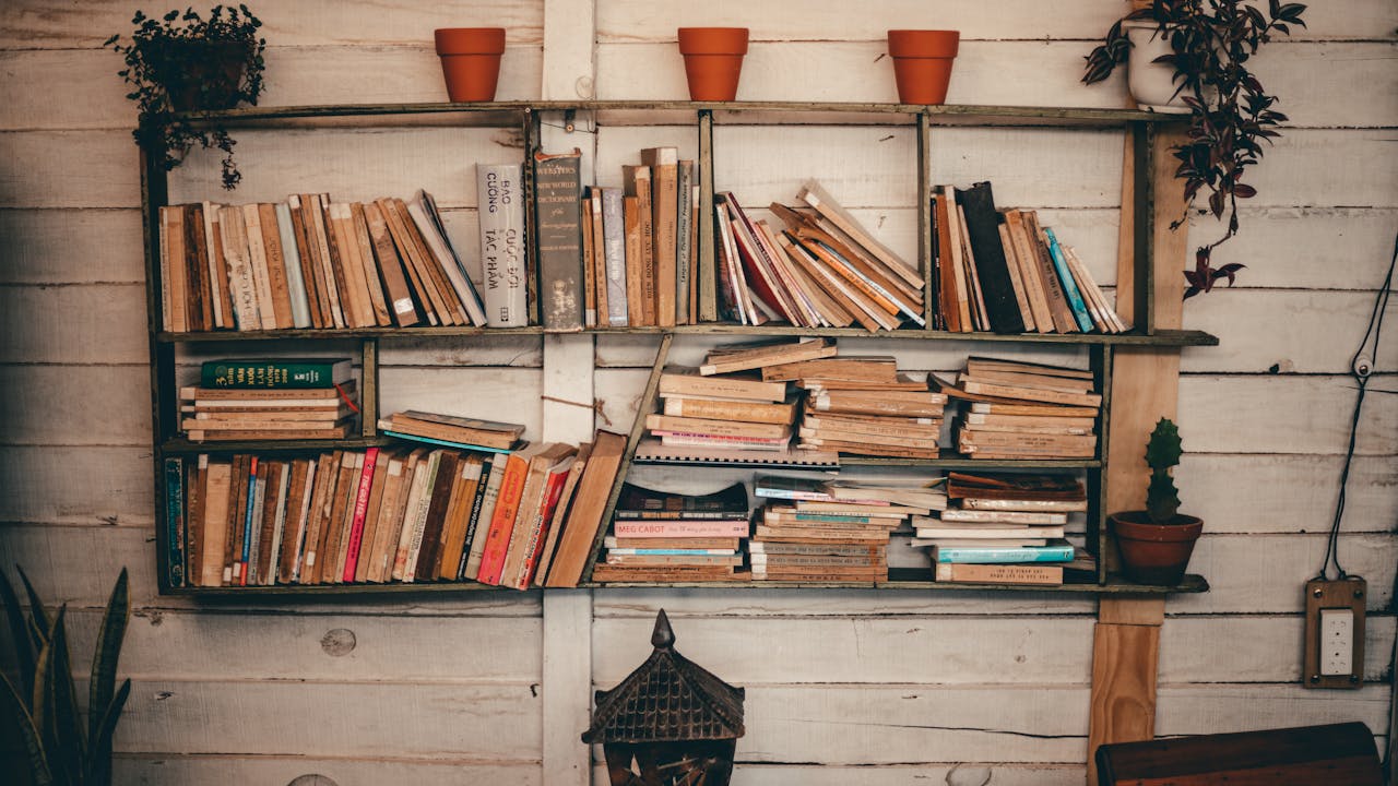 Stack of beloved books on wooden shelf