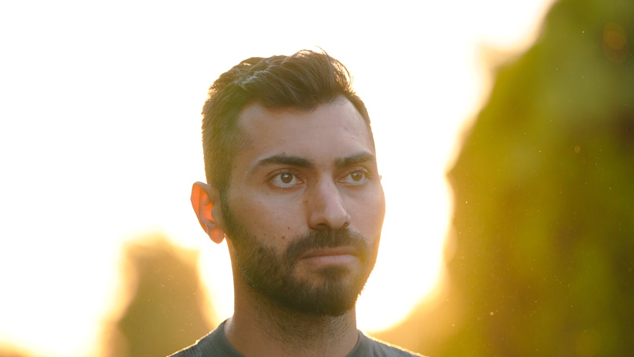 Portrait of a person bathed in warm golden hour light outdoors