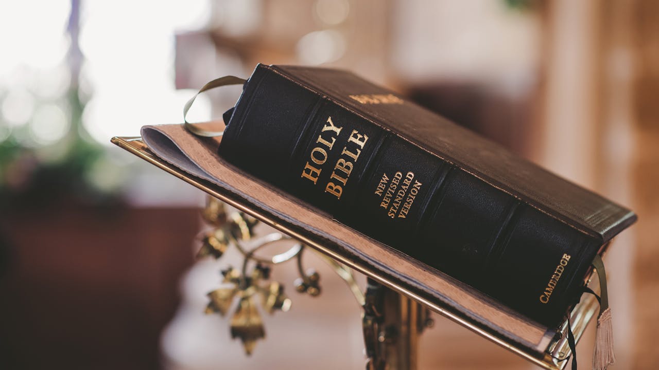 Open Bible with soft golden light on the pages