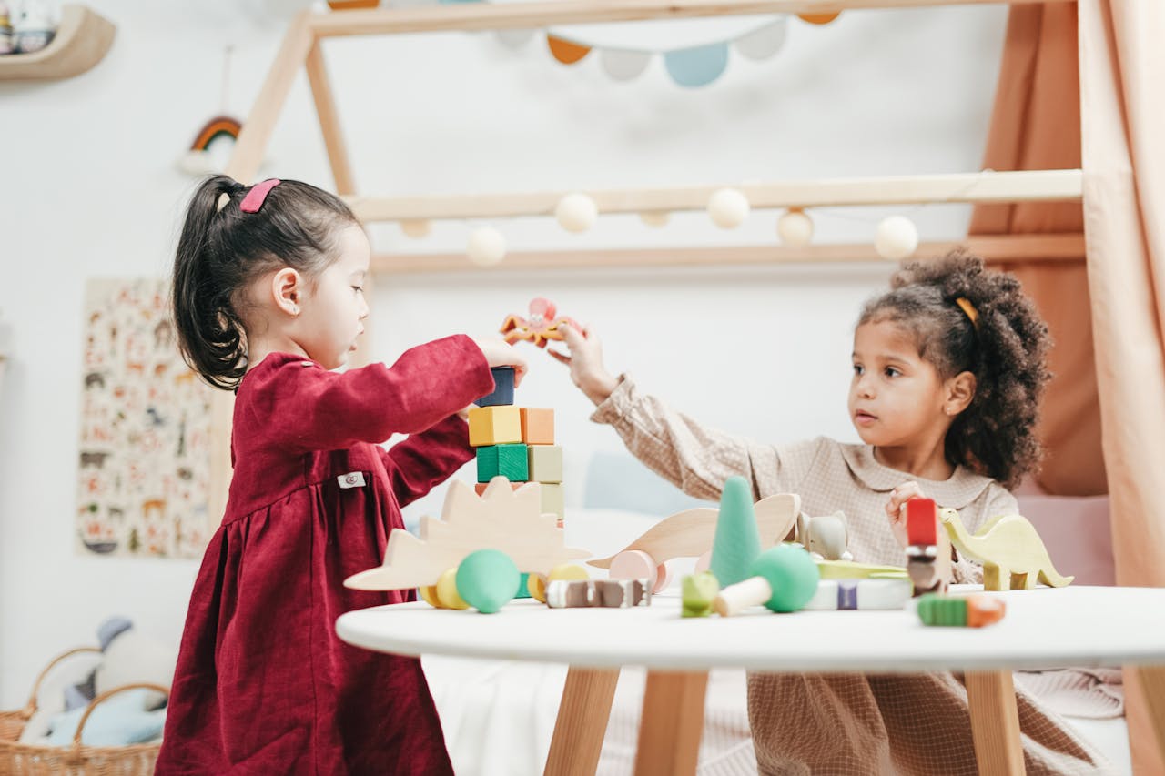 Child concentrating while building with colorful blocks