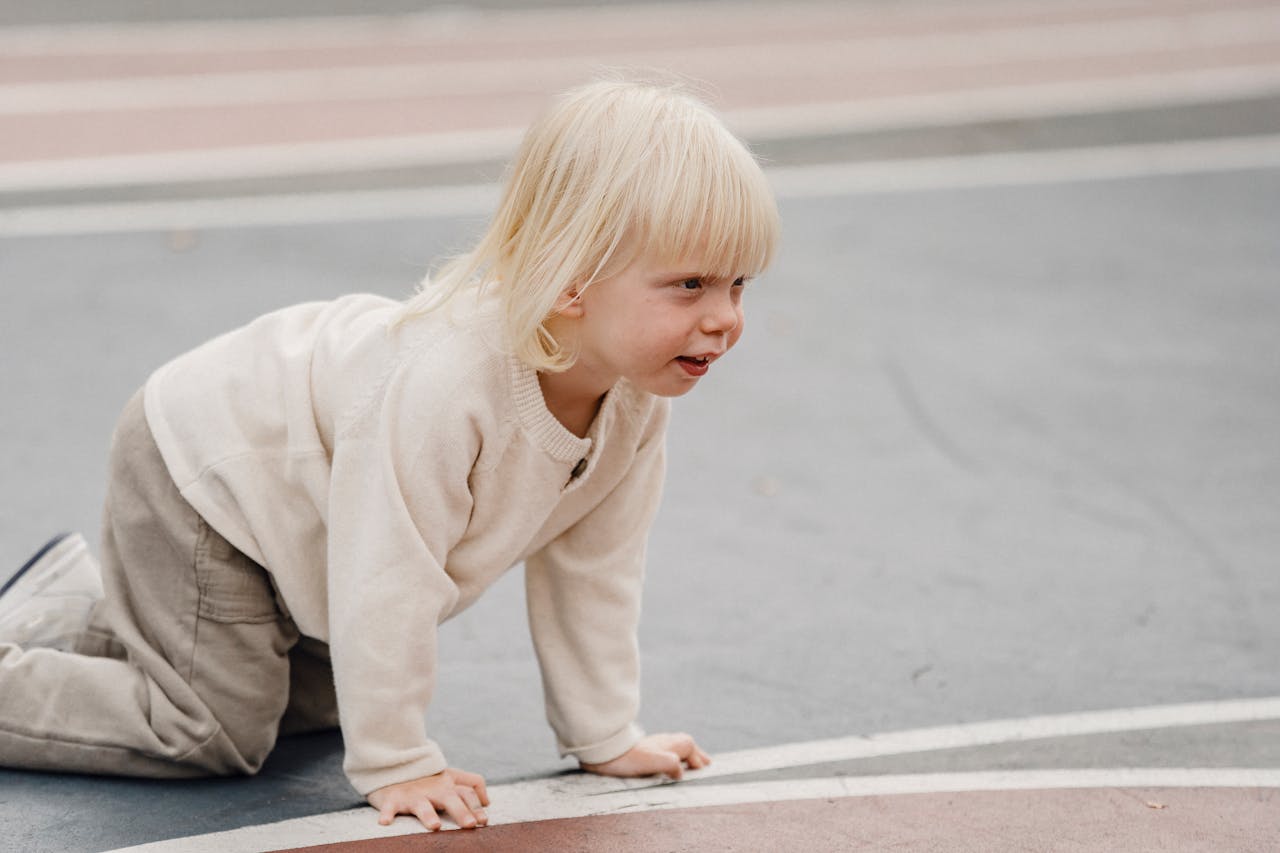 Child playing happily outdoors in the sunshine