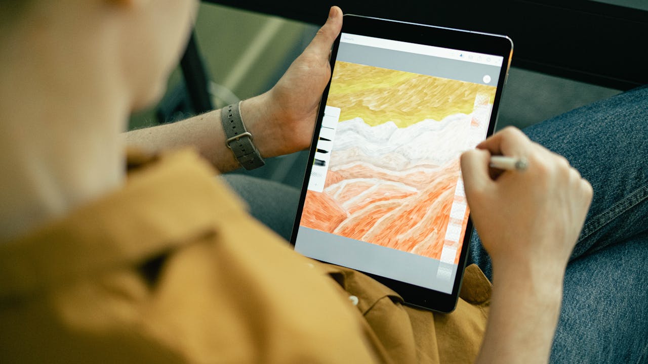 Digital artist working on a tablet with stylus