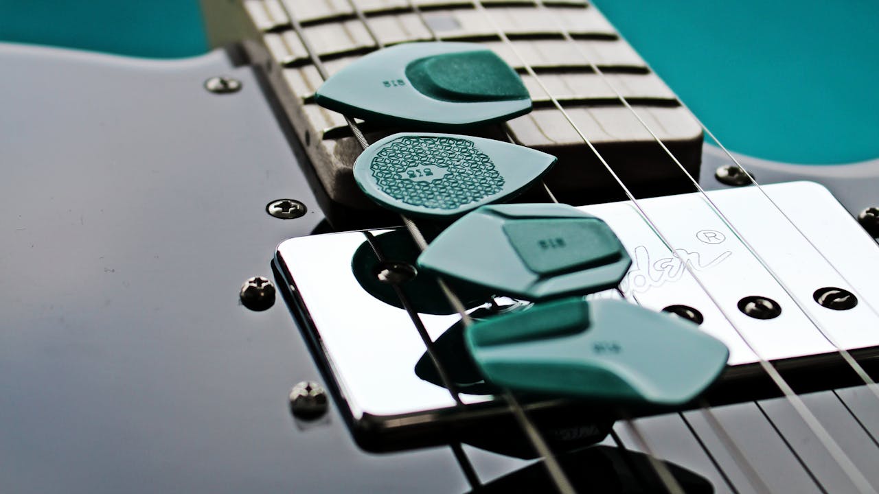 Close-up of guitar accessories including picks and strings