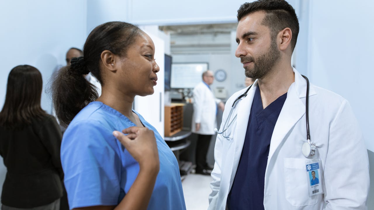 Nurse caring for a patient in a hospital setting