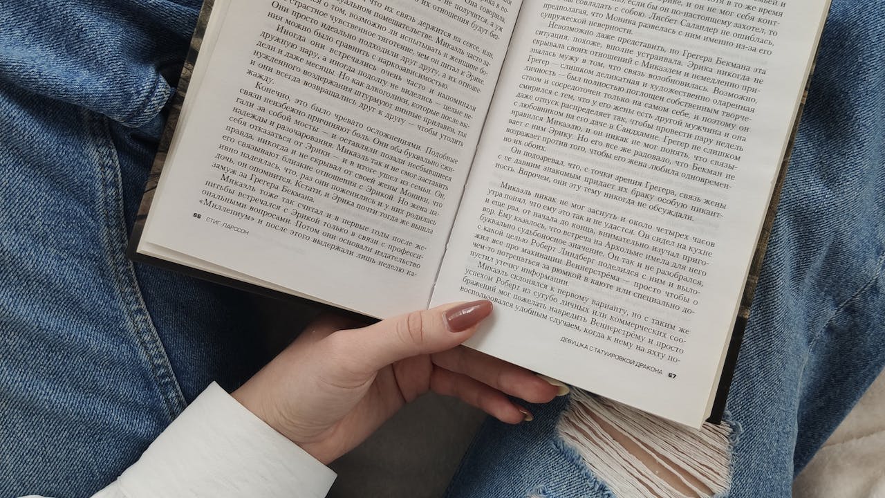 Nursing student studying with textbooks and notes