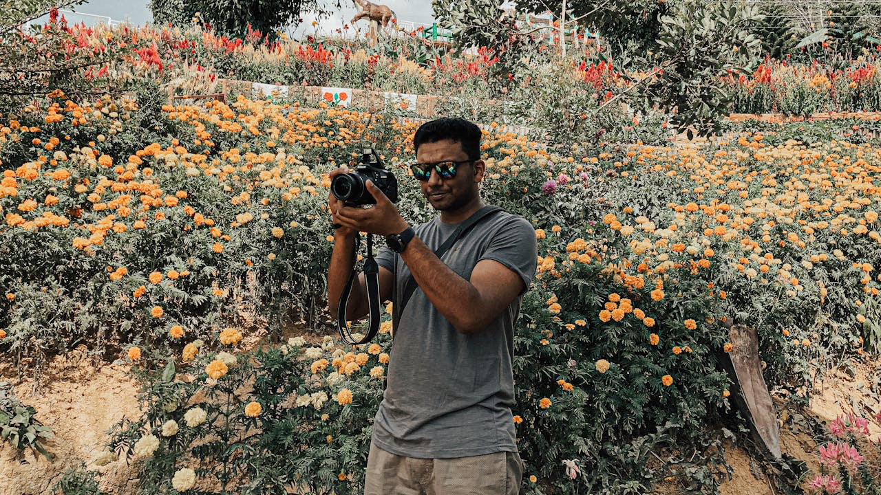 Photographer working with camera equipment outdoors