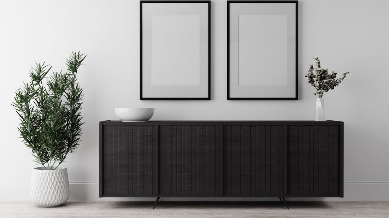 Framed photographs and art displayed on a living room wall
