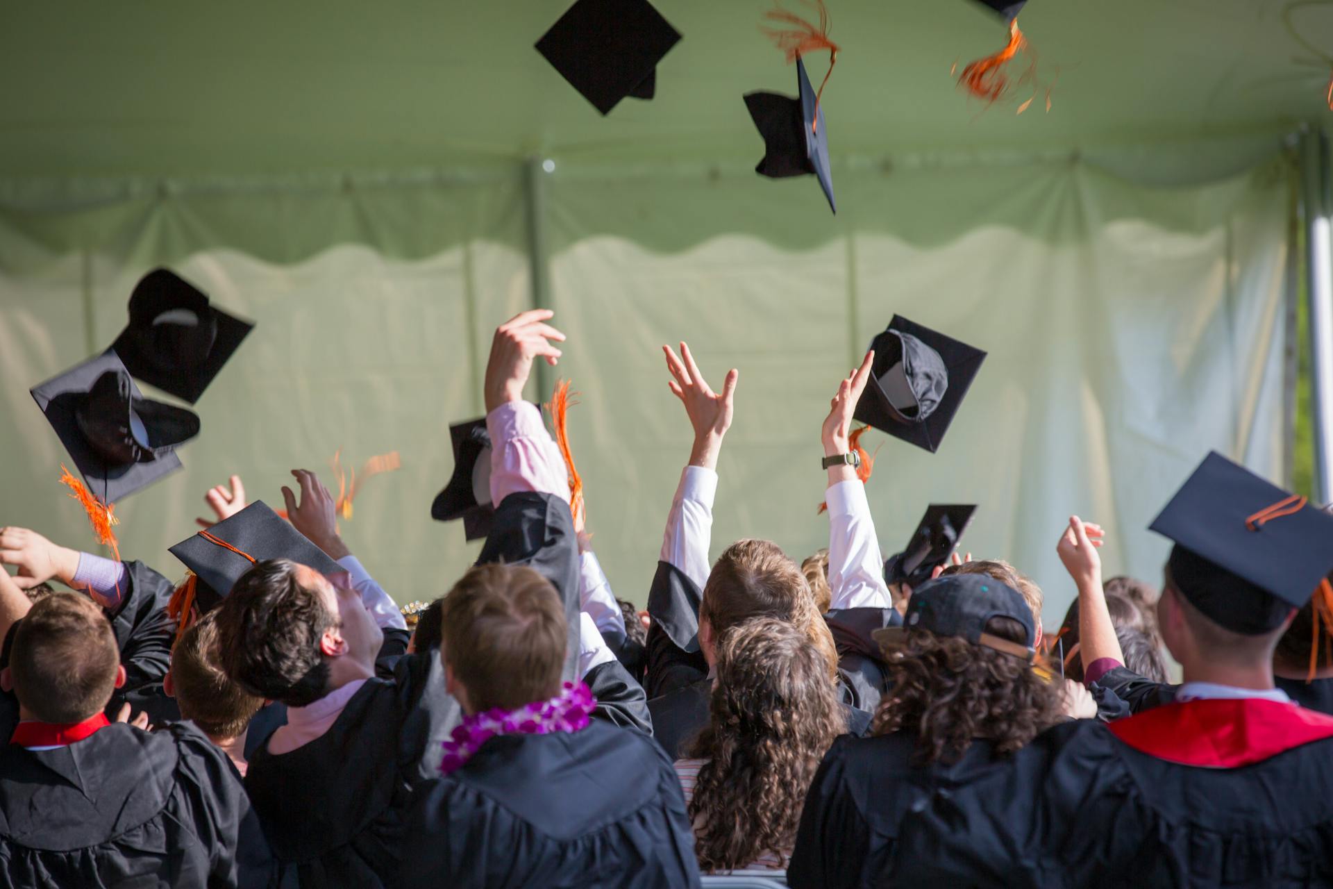 Happy graduates celebrating their achievement, perfect moment for meaningful graduation gifts for sons