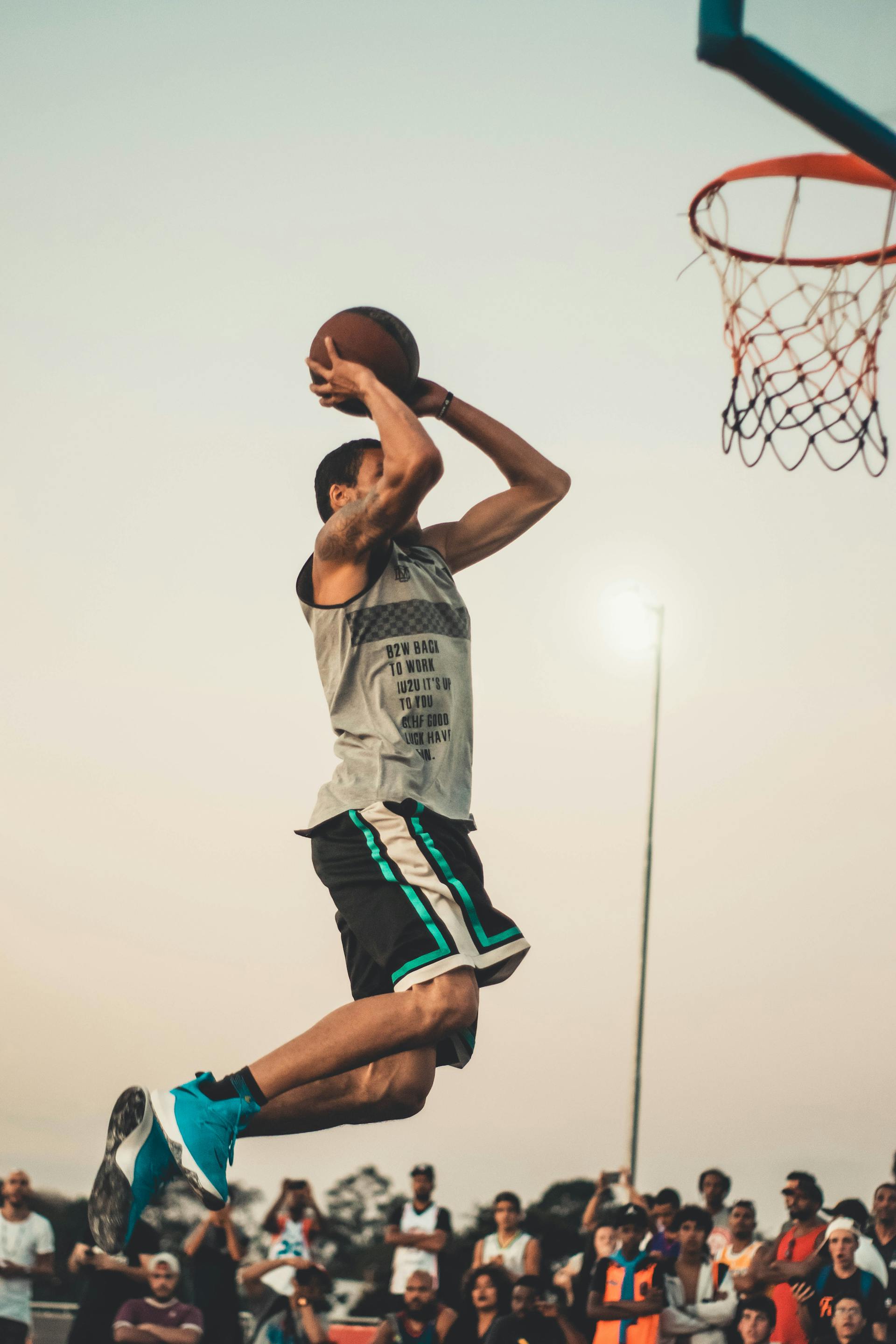 Young man playing basketball, athletic gifts and sports equipment for active sons