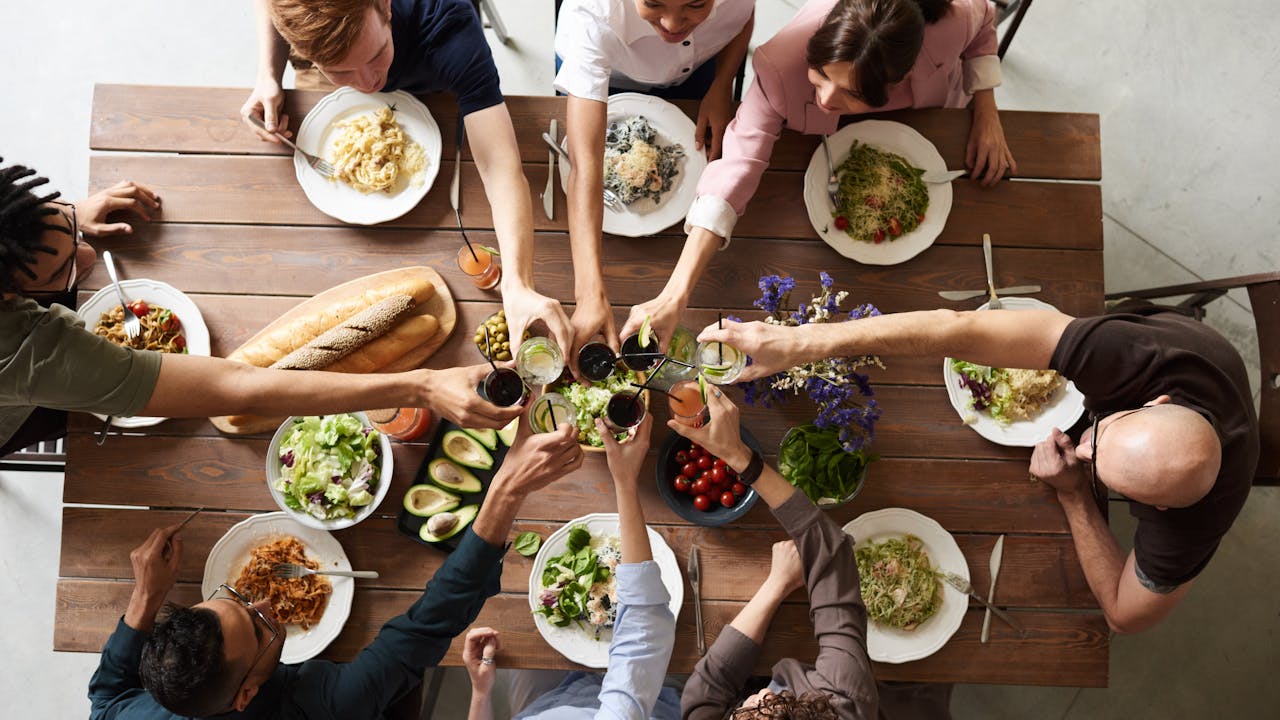 Family cooking together with fresh gluten-free ingredients in modern kitchen