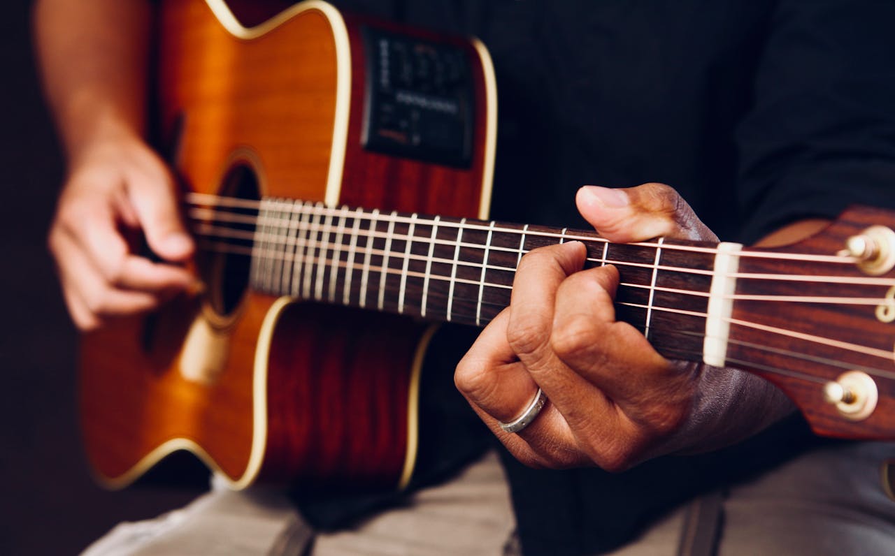 Guitar accessories and equipment on wooden surface