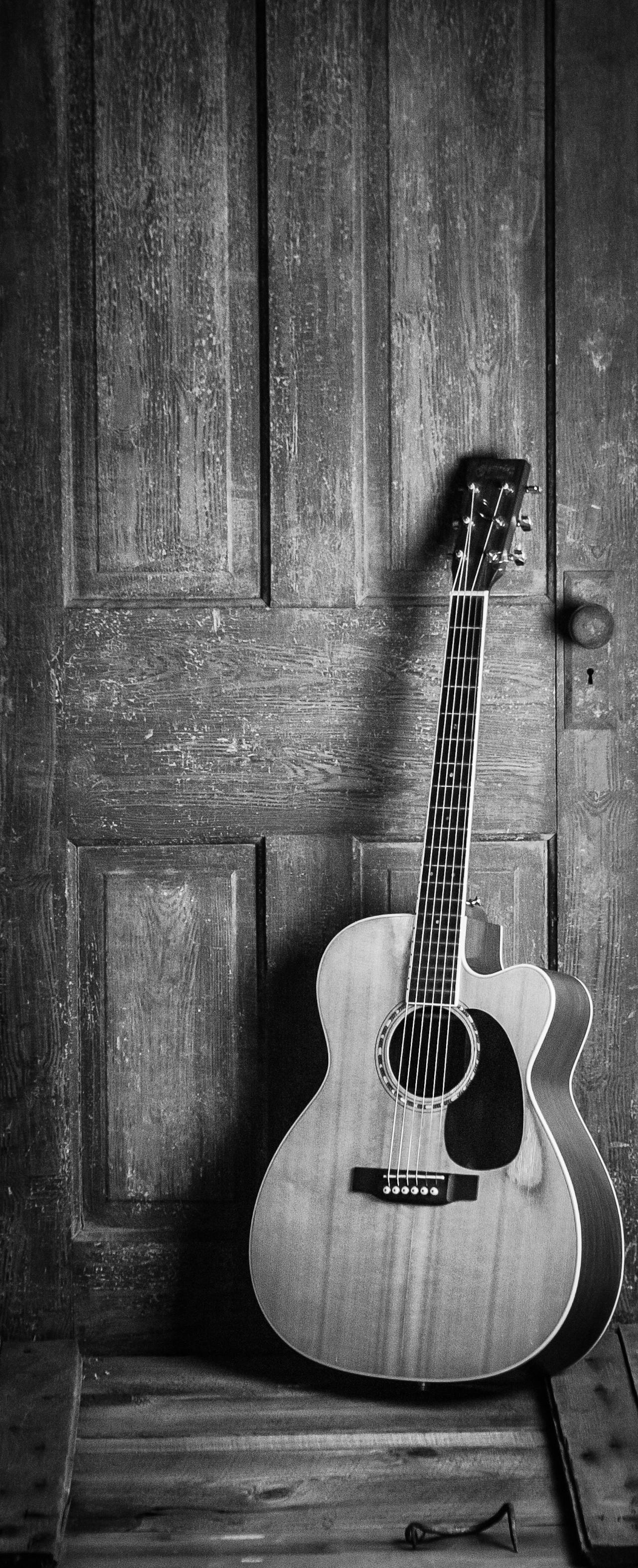 Guitar collection displayed on wall mounts
