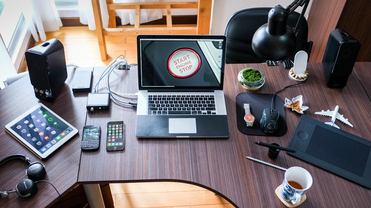 Modern office workspace with tech accessories and laptop