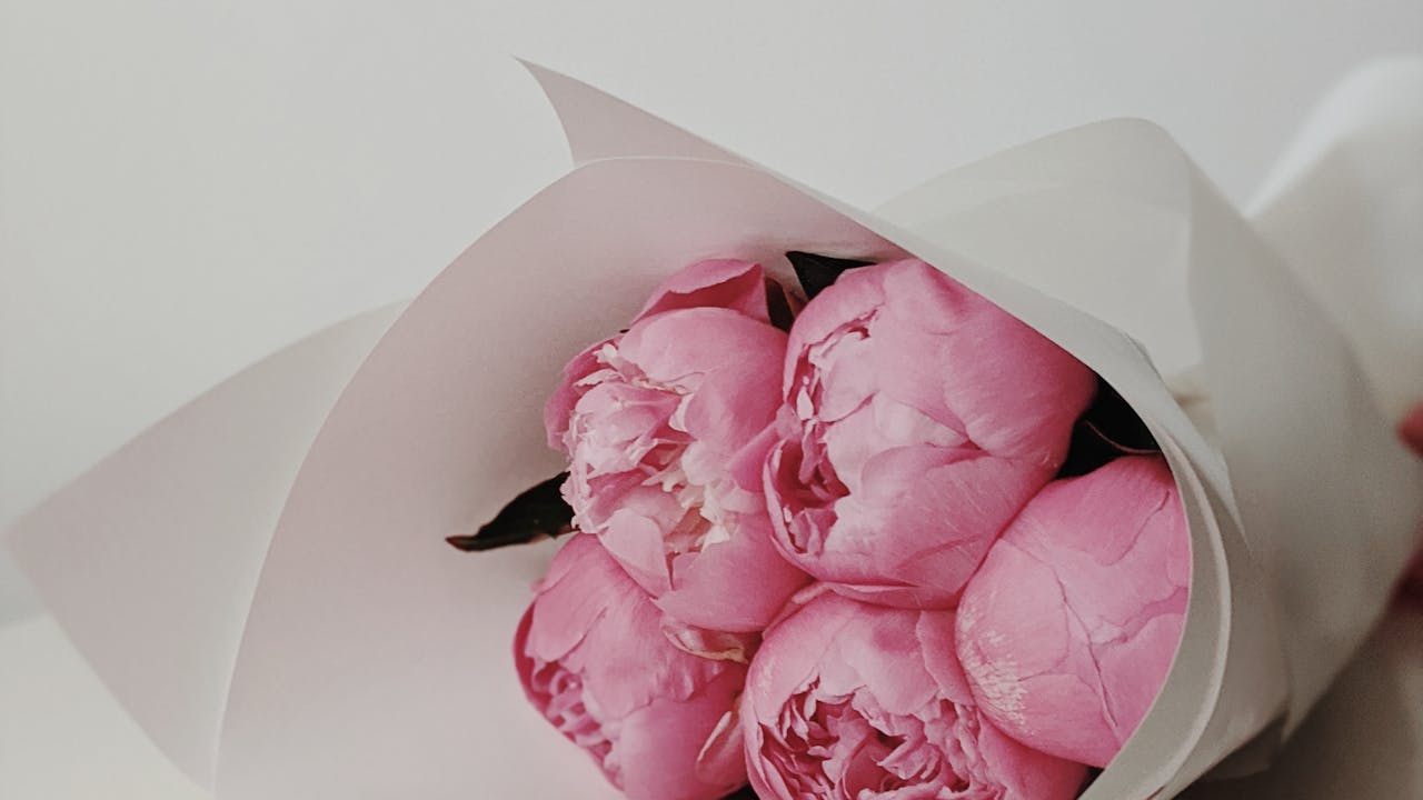 Fresh Valentine's Day flower bouquet in soft pink and red tones