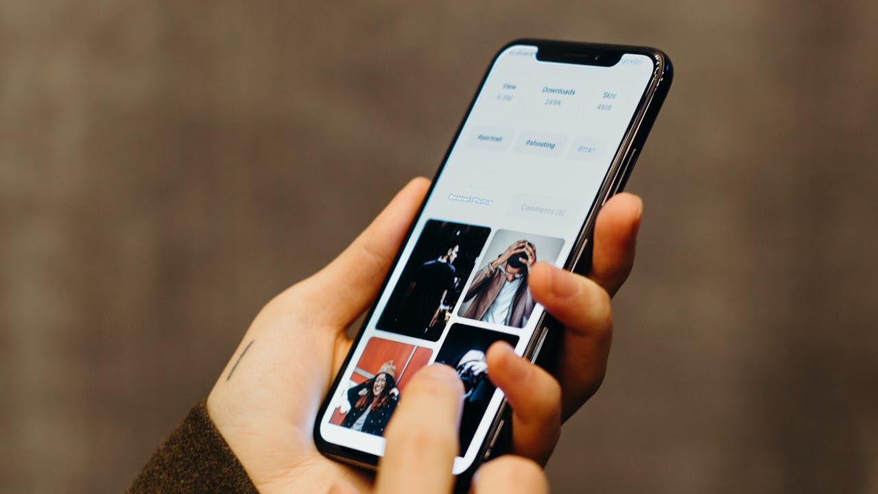 Person scrolling through photos on phone