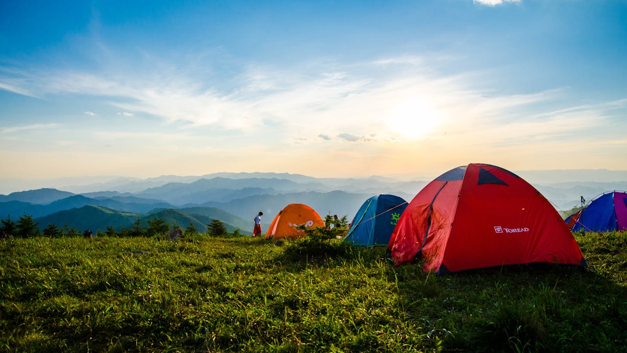 Camping tent and gear setup in nature