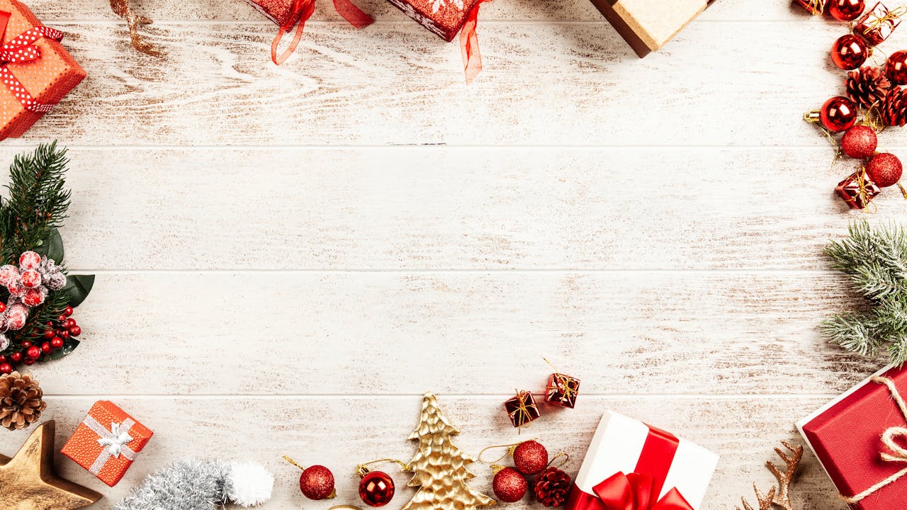 Close-up of handmade wooden Christmas ornaments hanging on a tree branch