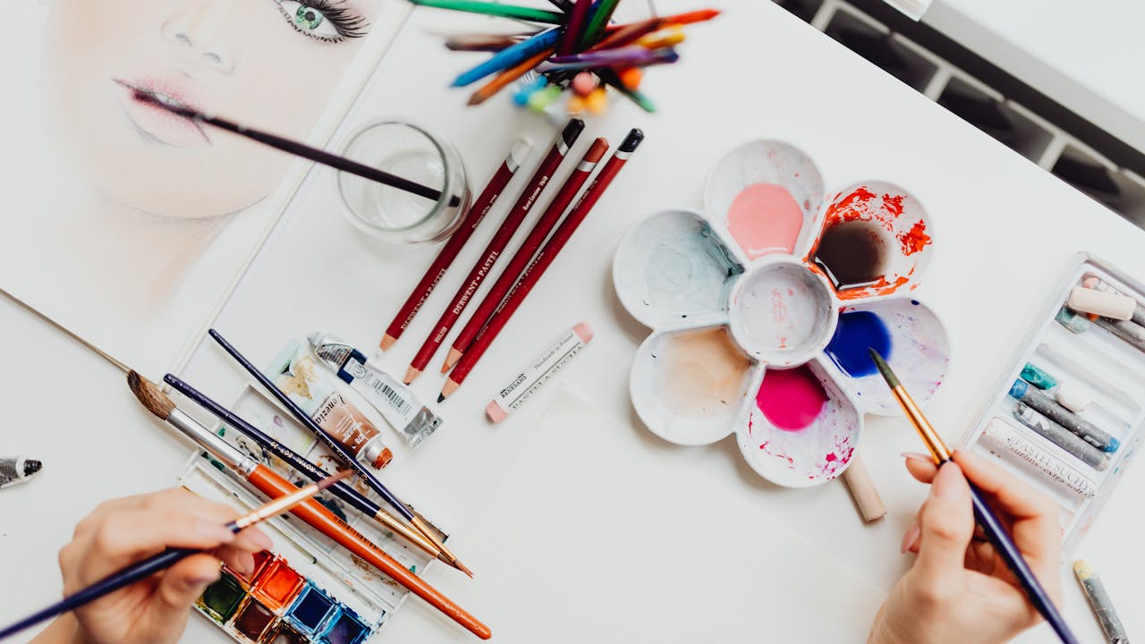 Art supplies and paint brushes for pet portrait painting
