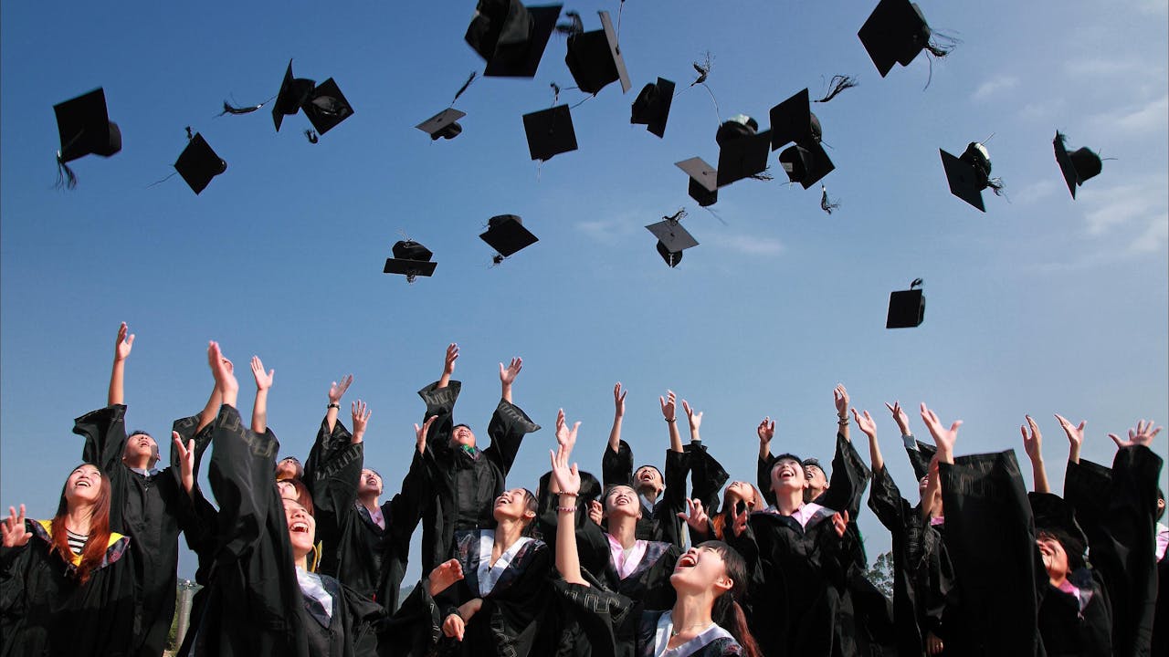 Graduate in academic regalia at commencement ceremony