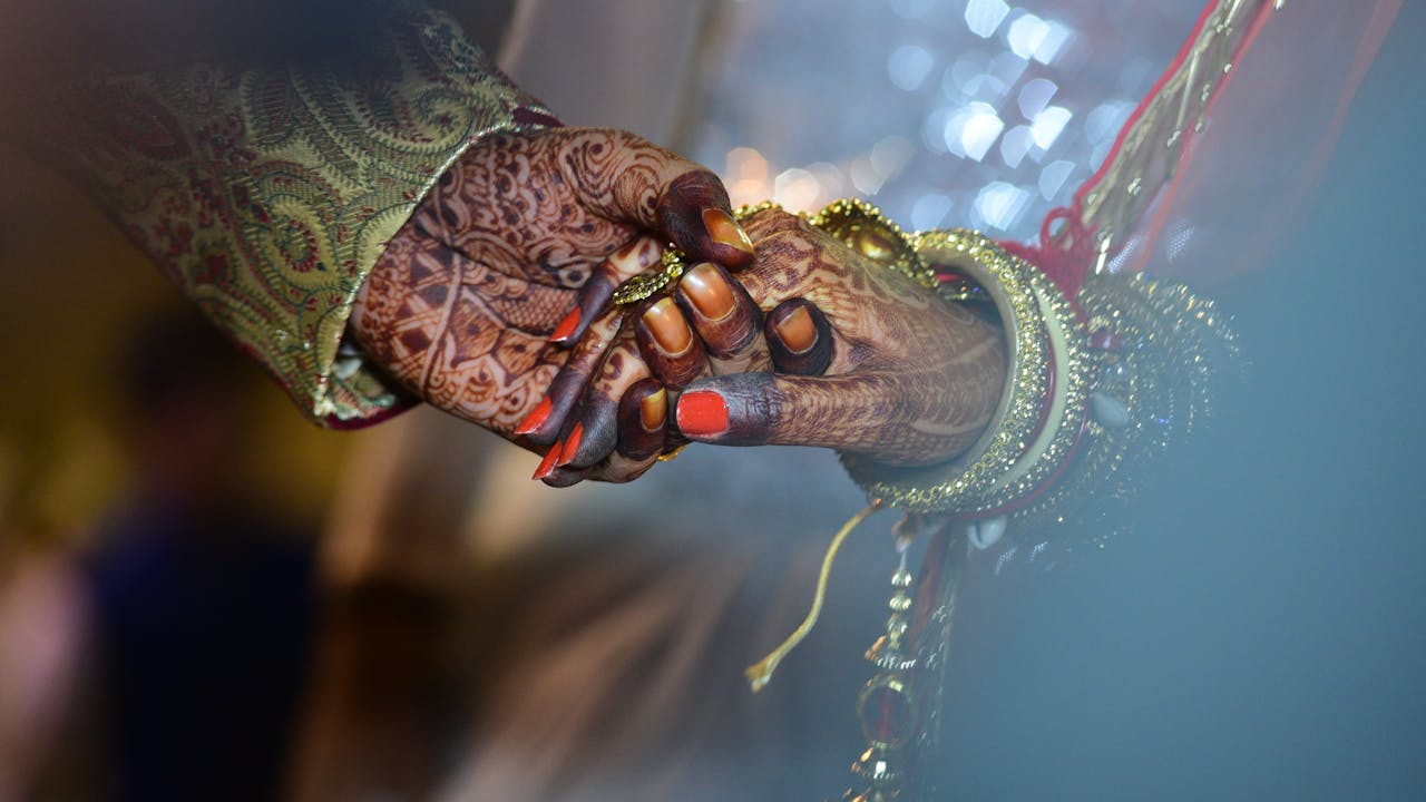 Groom preparing on wedding morning with personal gifts and accessories
