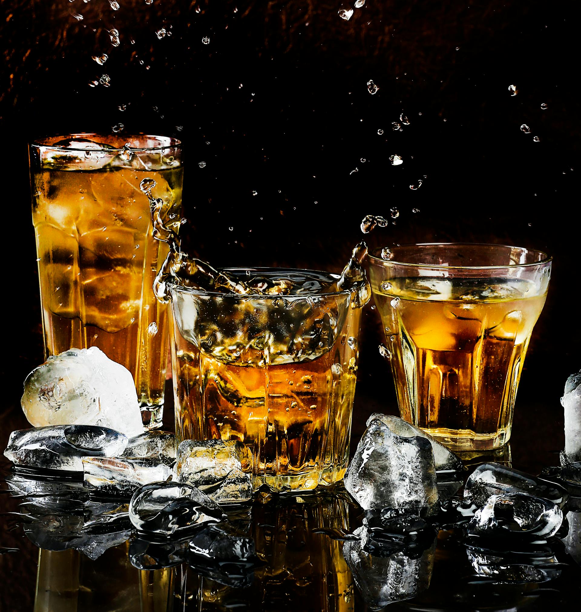 Elegant whiskey decanter set with glasses on wooden table