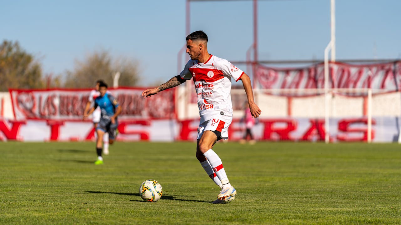 Soccer player practicing on a green field