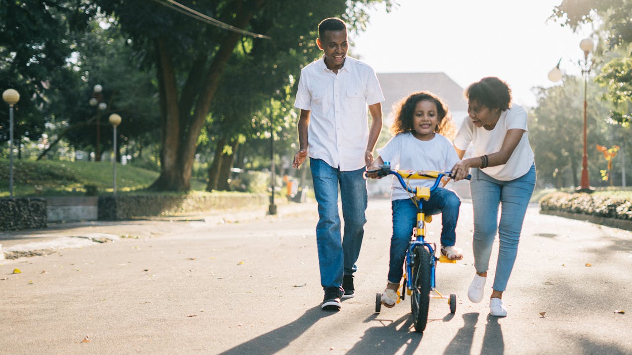 Happy family enjoying outdoor summer activities together