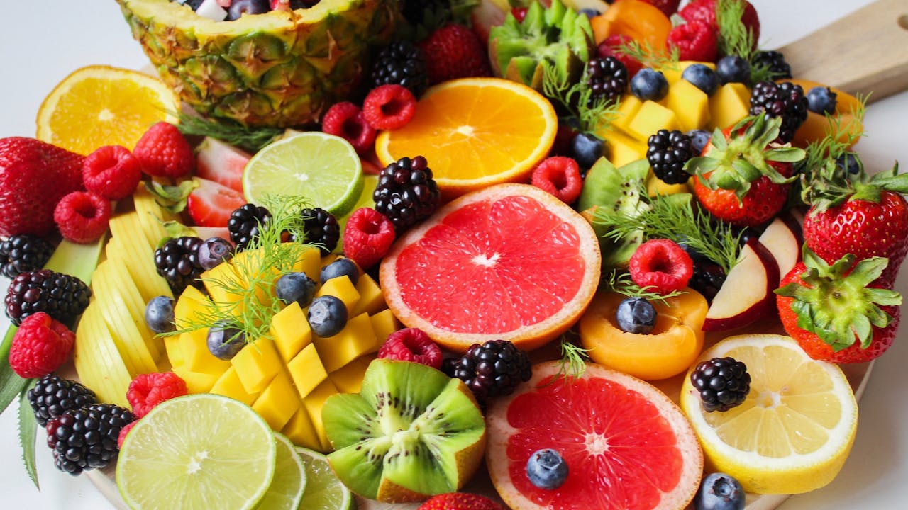 Fresh summer fruit beautifully arranged in a woven basket