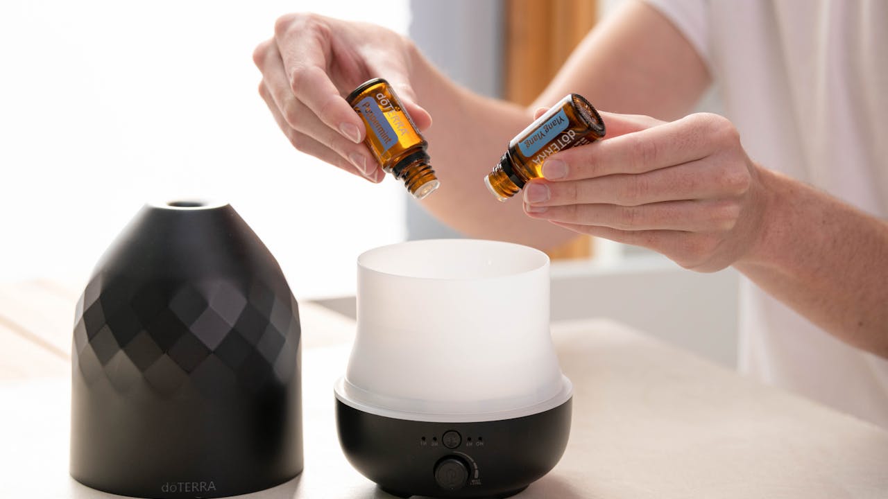 Essential oils and aromatherapy bottles arranged on a wooden surface